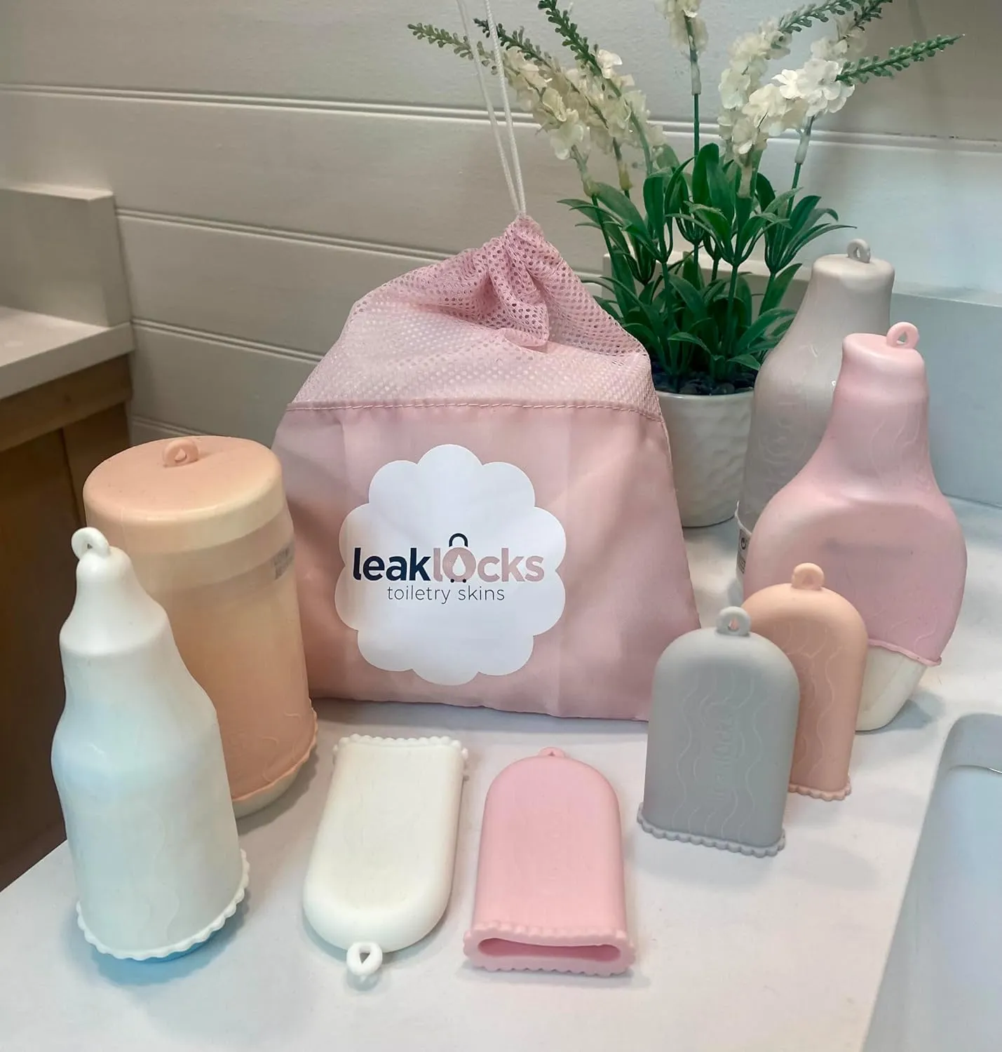 LeakLocks® Toiletry Skins 4-Pack w/Travel Bag. Elastic Sleeve for Leak-Proofing Travel Container in Luggage. Fits Standard/Travel Sized Toiletries. Reusable Accessory for Travel Bag Suitcase/Carry-on